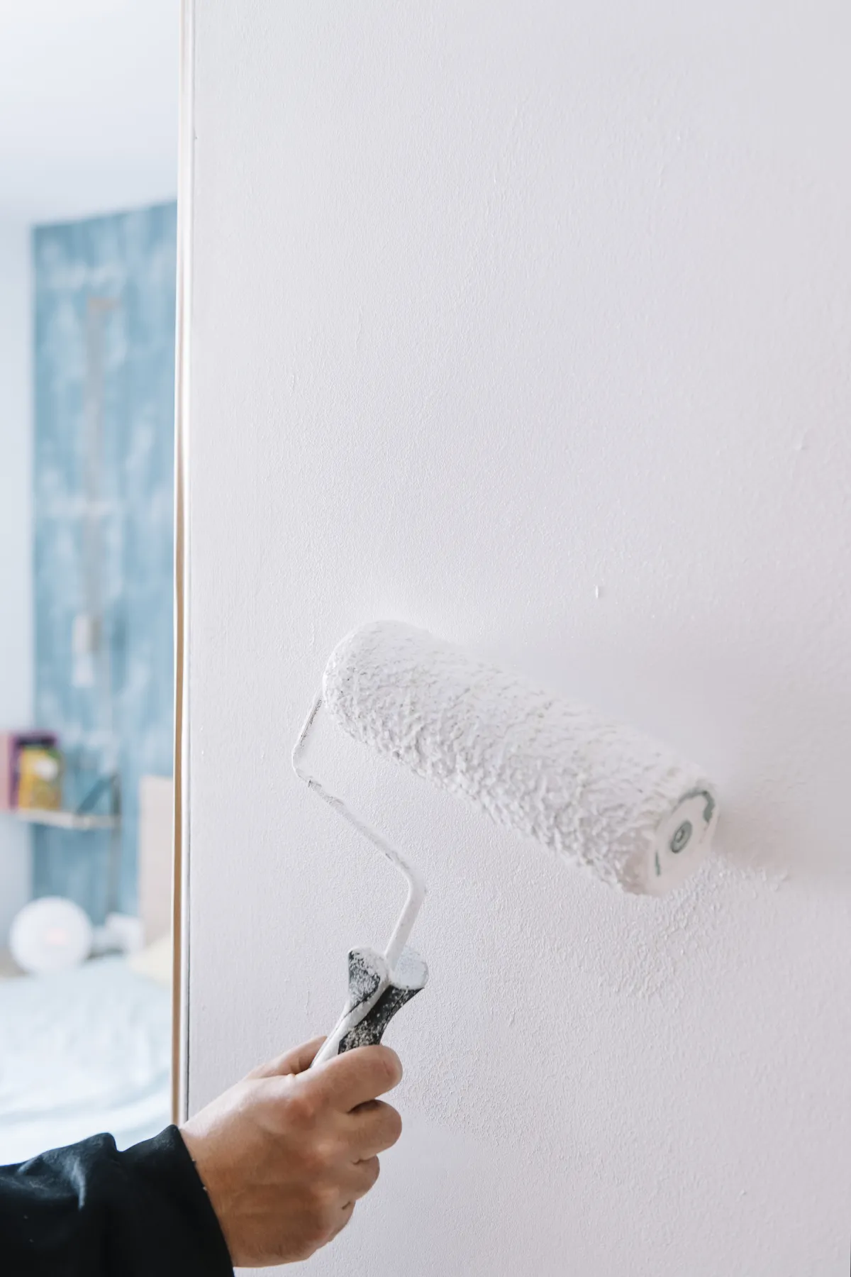 Residential bedroom painting with roller application