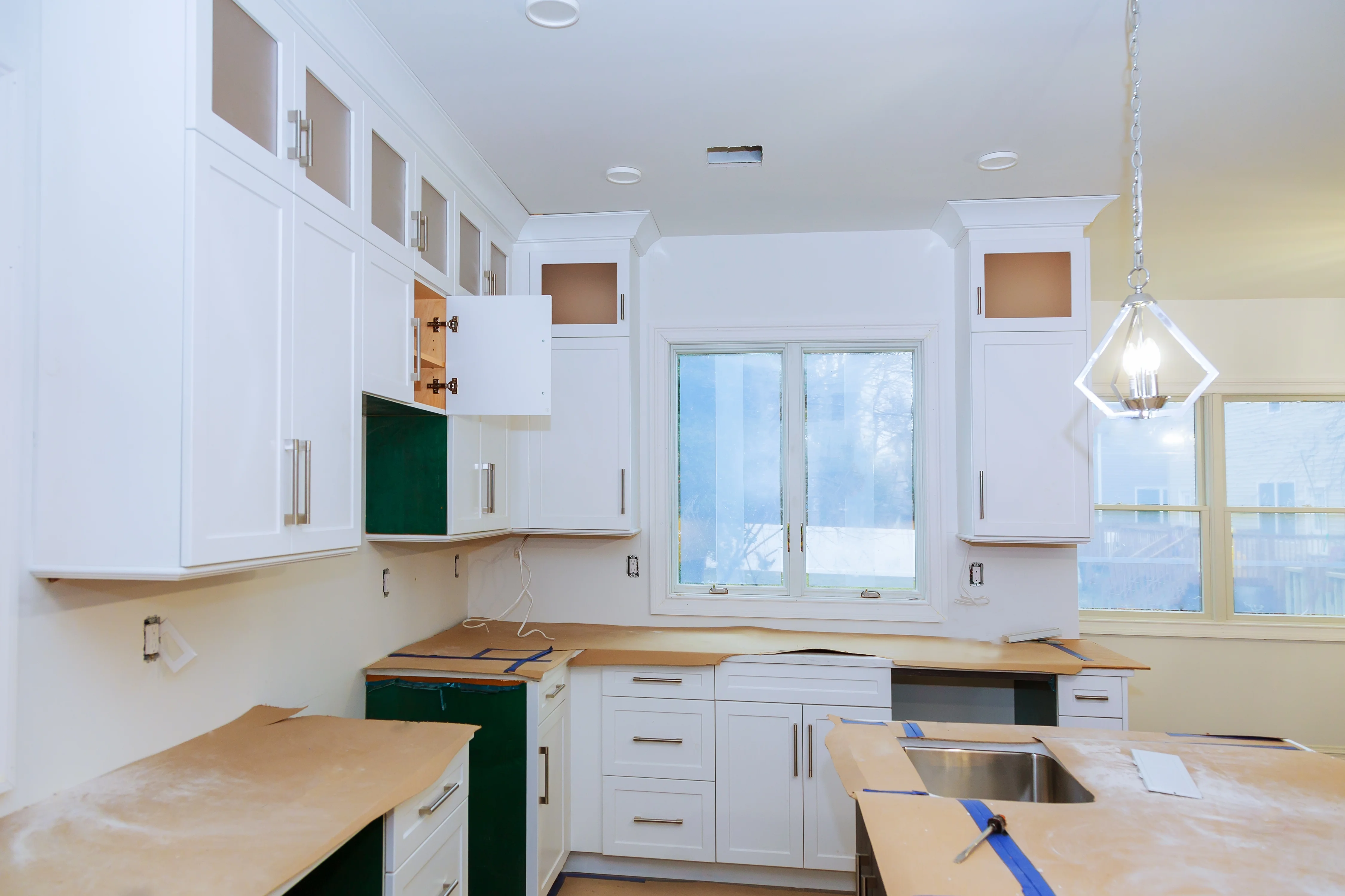Two-tone kitchen cabinet painting trends Toronto 2025 — upper and lower cabinet colours